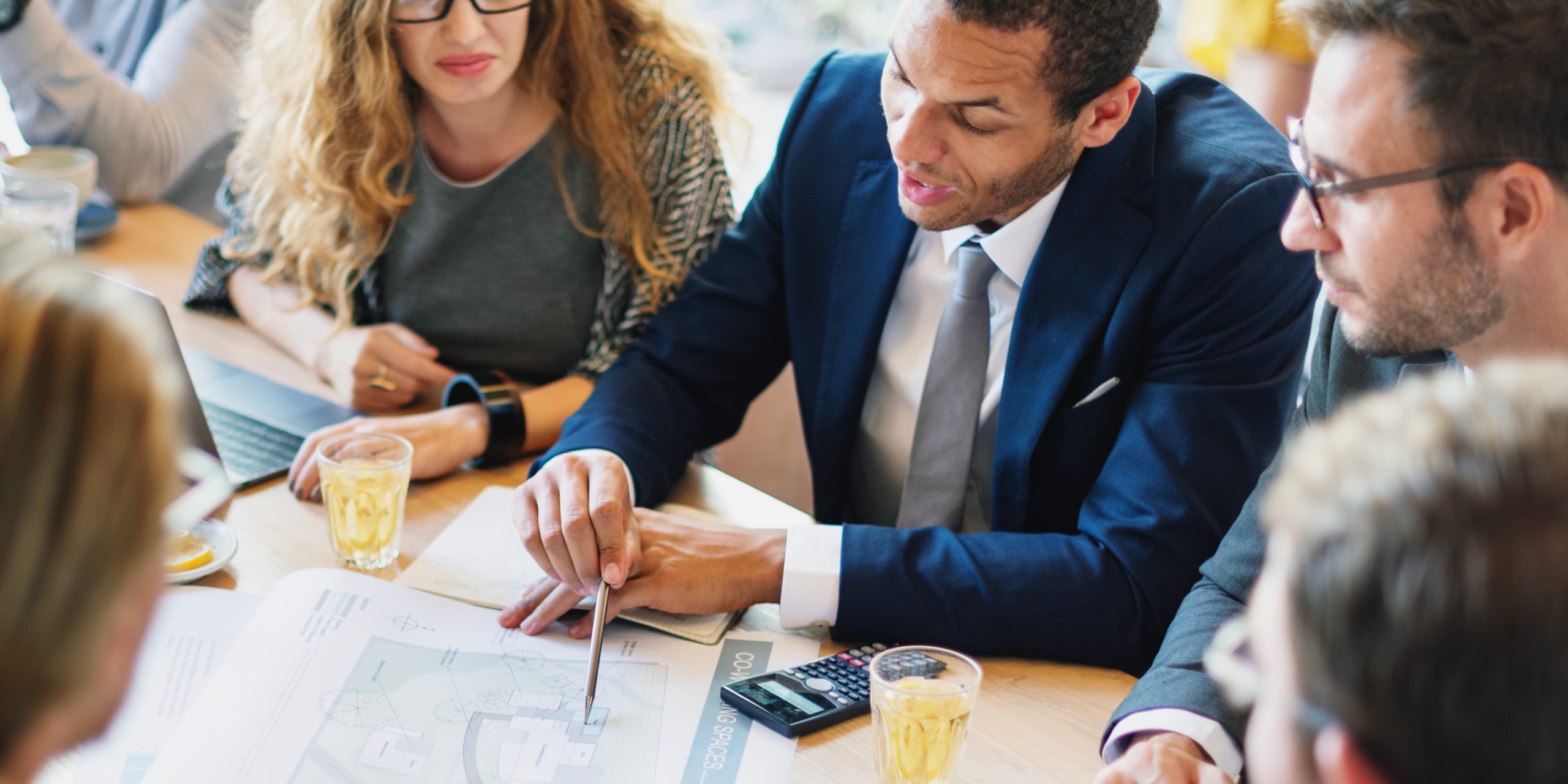 group-professionals-meeting-discussing-business-plans-diverse-team-collaborating-sharing-ideas-analyzing-documents-corporate-setting-diverse-business-people-working-together-cafe