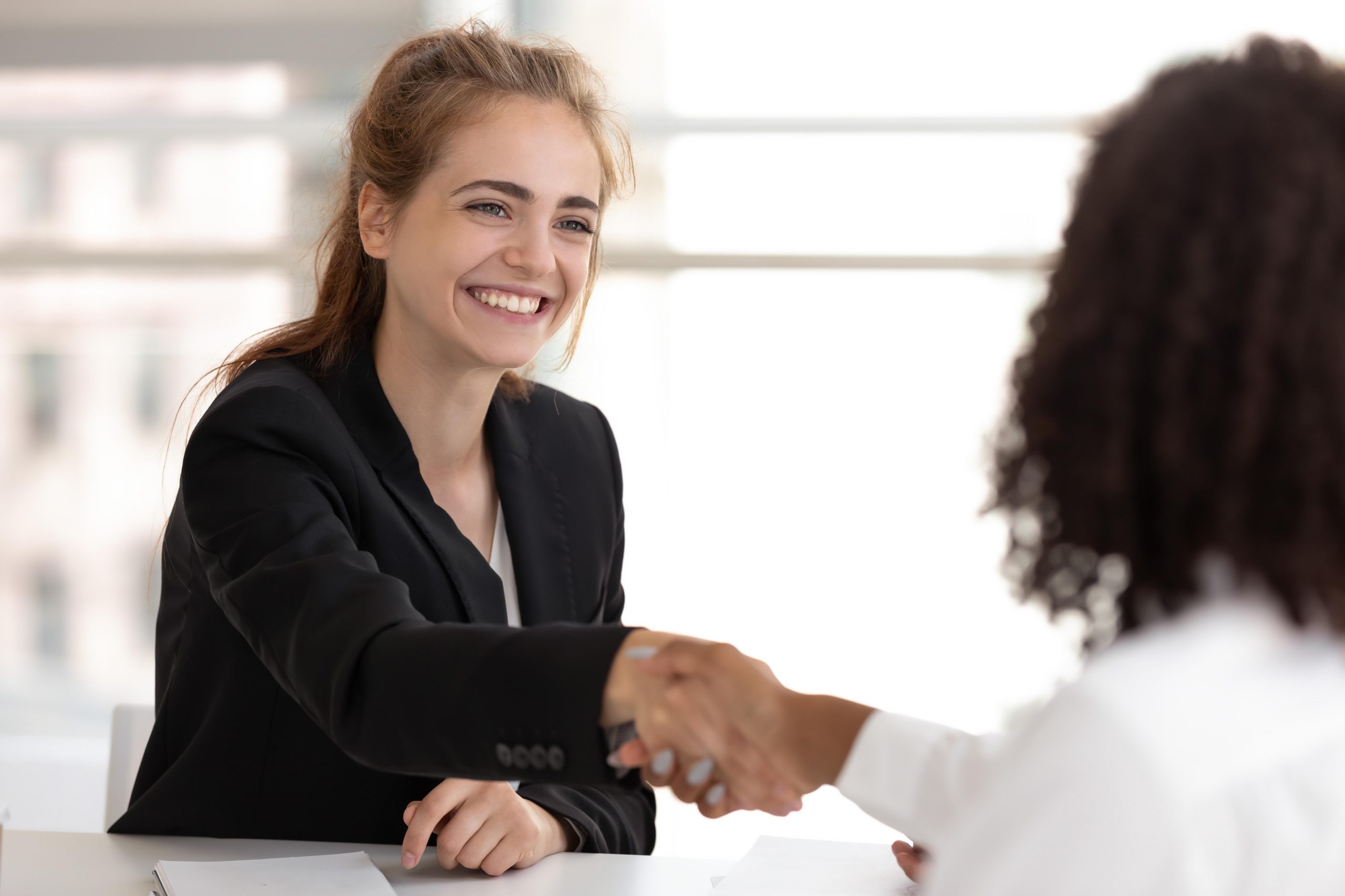 happy-businesswoman-hr-manager-handshake-hire-candidate-selling-insurance-services-making-good-first-impression-diverse-broker-client-customer-shake-hand-business-office-meeting-job-interview